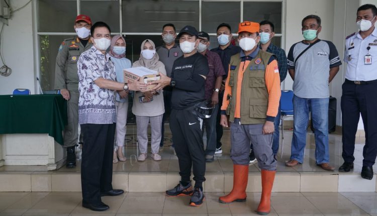 Pemkot Kotamobagu Menyerahkan Bantuan Kepada Korban Bencana Alam di Manado